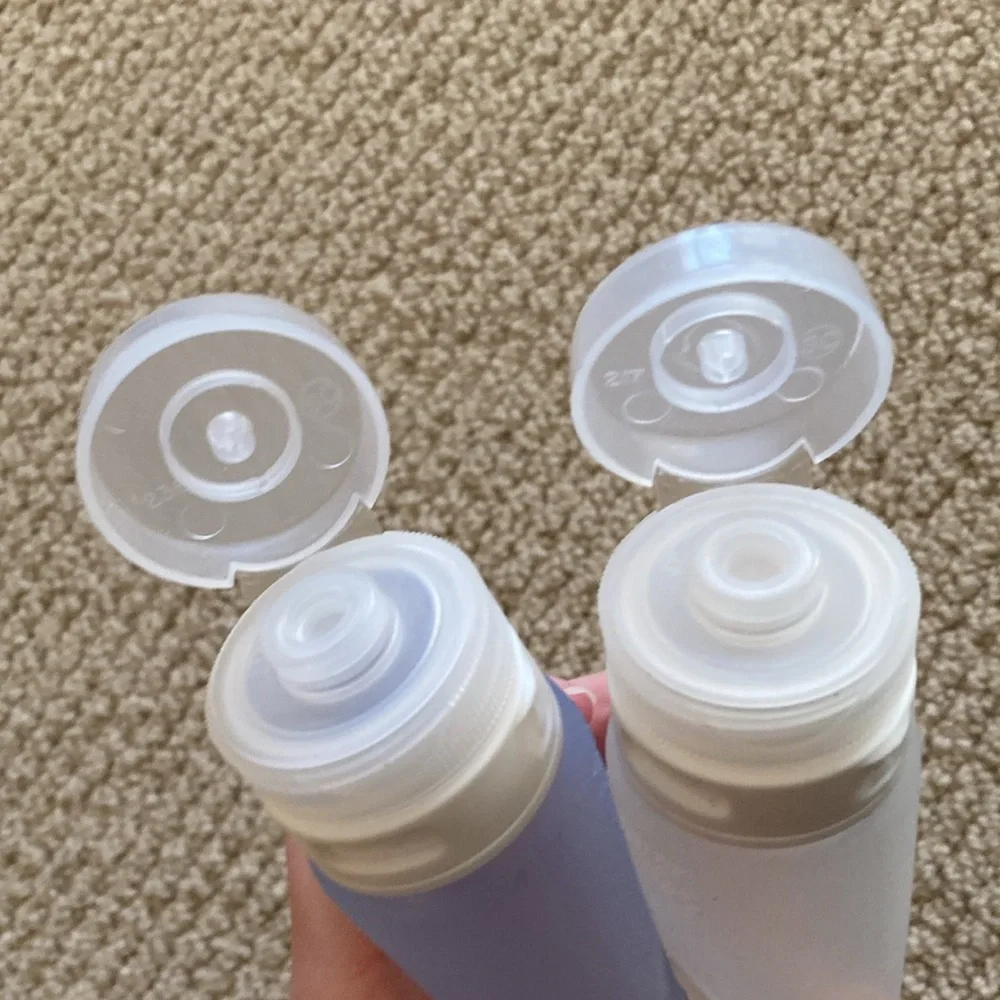 REI Reusable Liquids Containers Silicone Flexible Set Two Travel Airline Clear